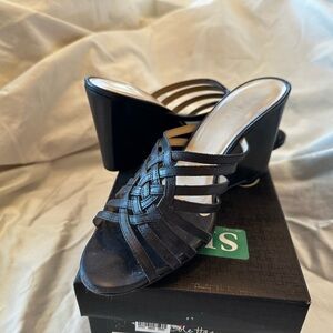 Cole Haan black wedge sandal.